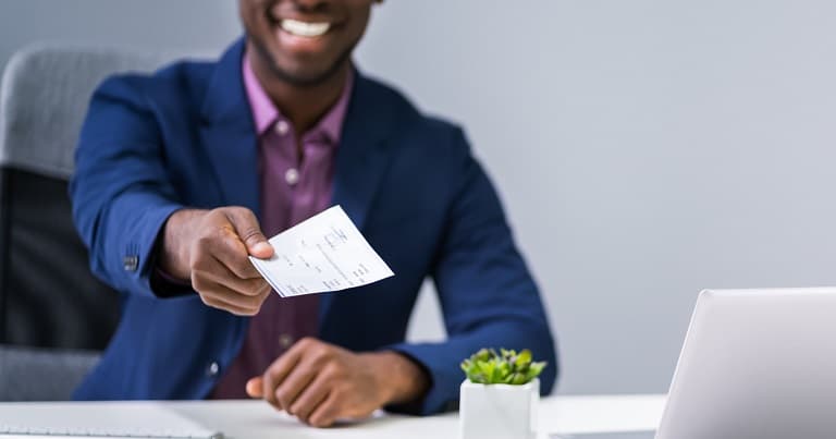 A lawyer producing a check